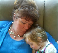 Grandchild sleeping with grandma